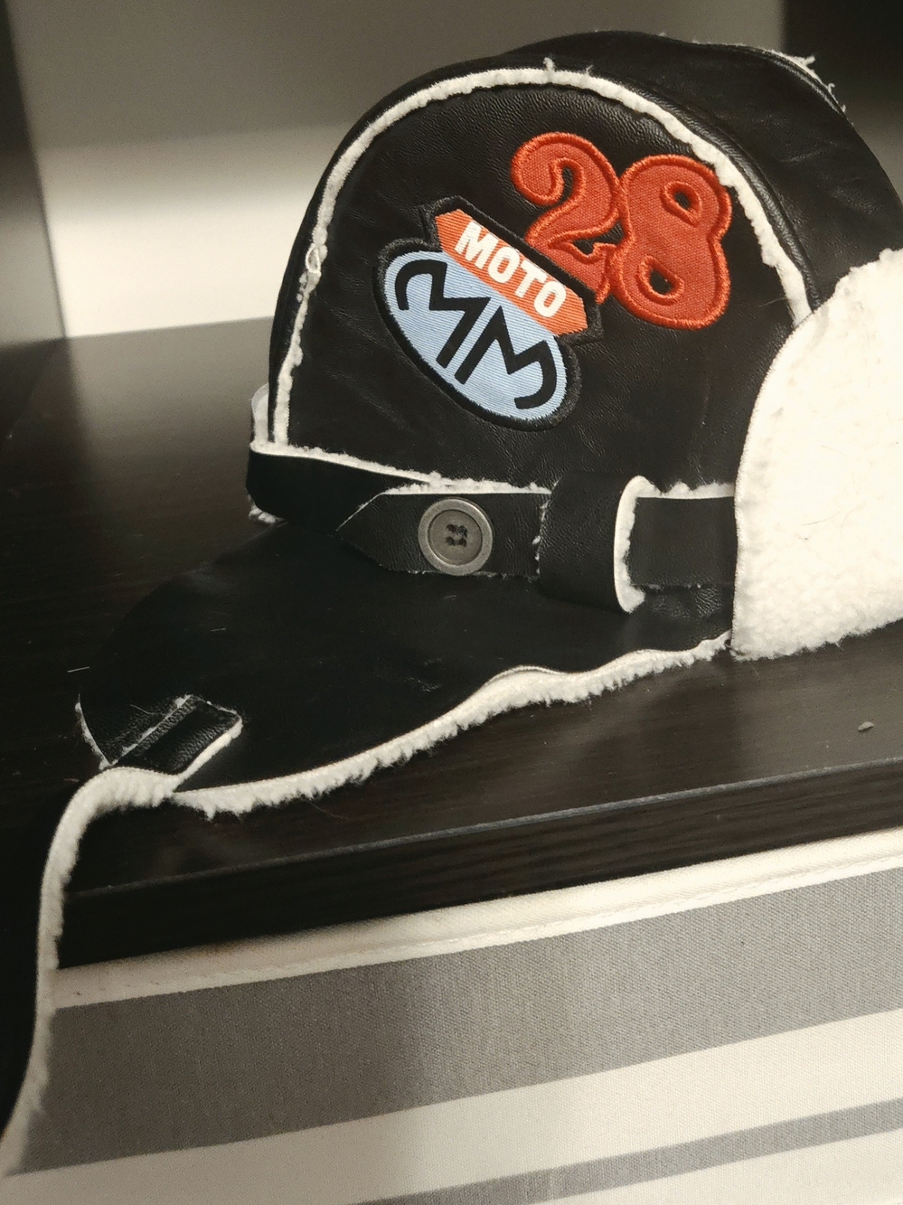 Disney Black Trapper Hat with Orange Moto Patch and Light Blue Accent